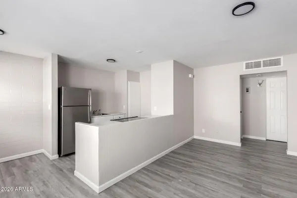 a view of kitchen with wooden floor
