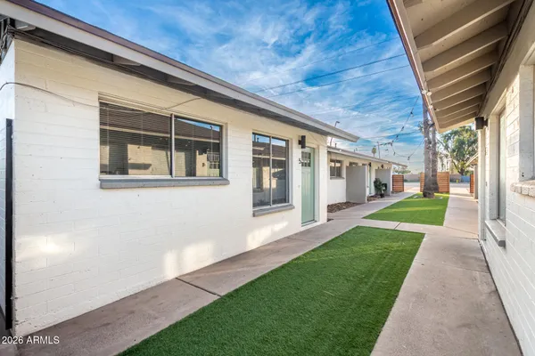 a view of house with backyard porch and wooden floor