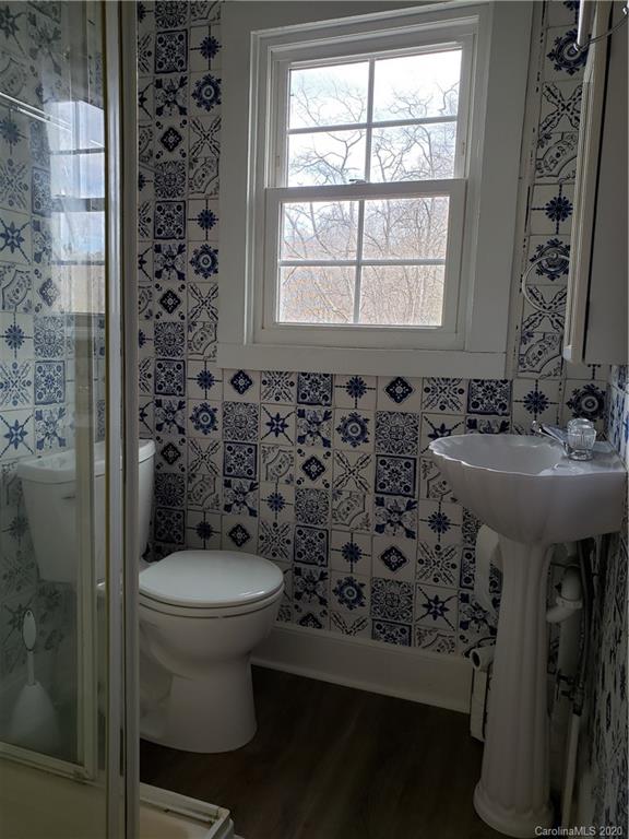 831 Dale Road Spruce Pine, NC 28777 - Photo 15 of 21 a bathroom with a sink toilet and mirror