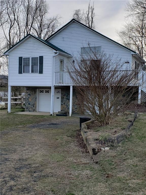 831 Dale Road Spruce Pine, NC 28777 - Photo 2 of 21 a front view of a house with a yard