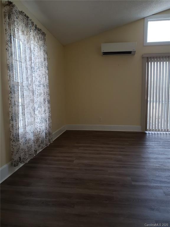 831 Dale Road Spruce Pine, NC 28777 - Photo 6 of 21 a view of wooden floor and windows in a room