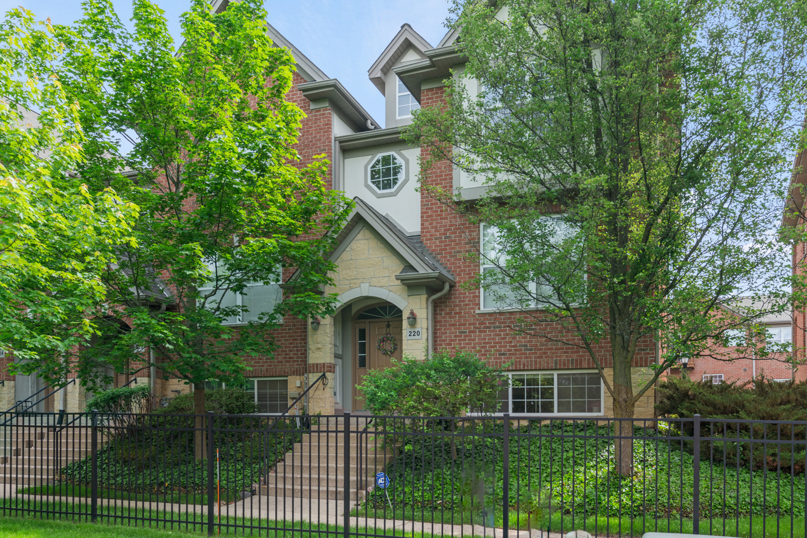 220 River Front Drive Mount Prospect, IL 60056 - Photo 1 of 33 a view of house with garden and tall trees