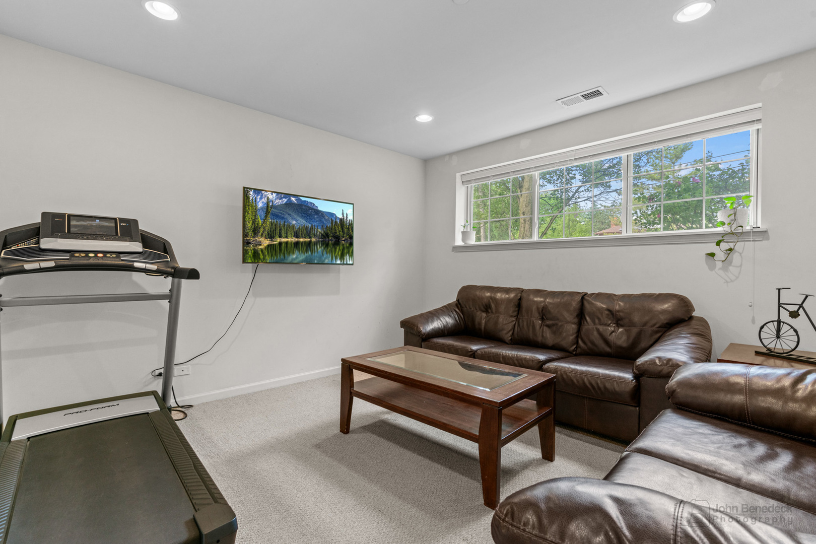 220 River Front Drive Mount Prospect, IL 60056 - Photo 26 of 33 a living room with furniture and a flat screen tv