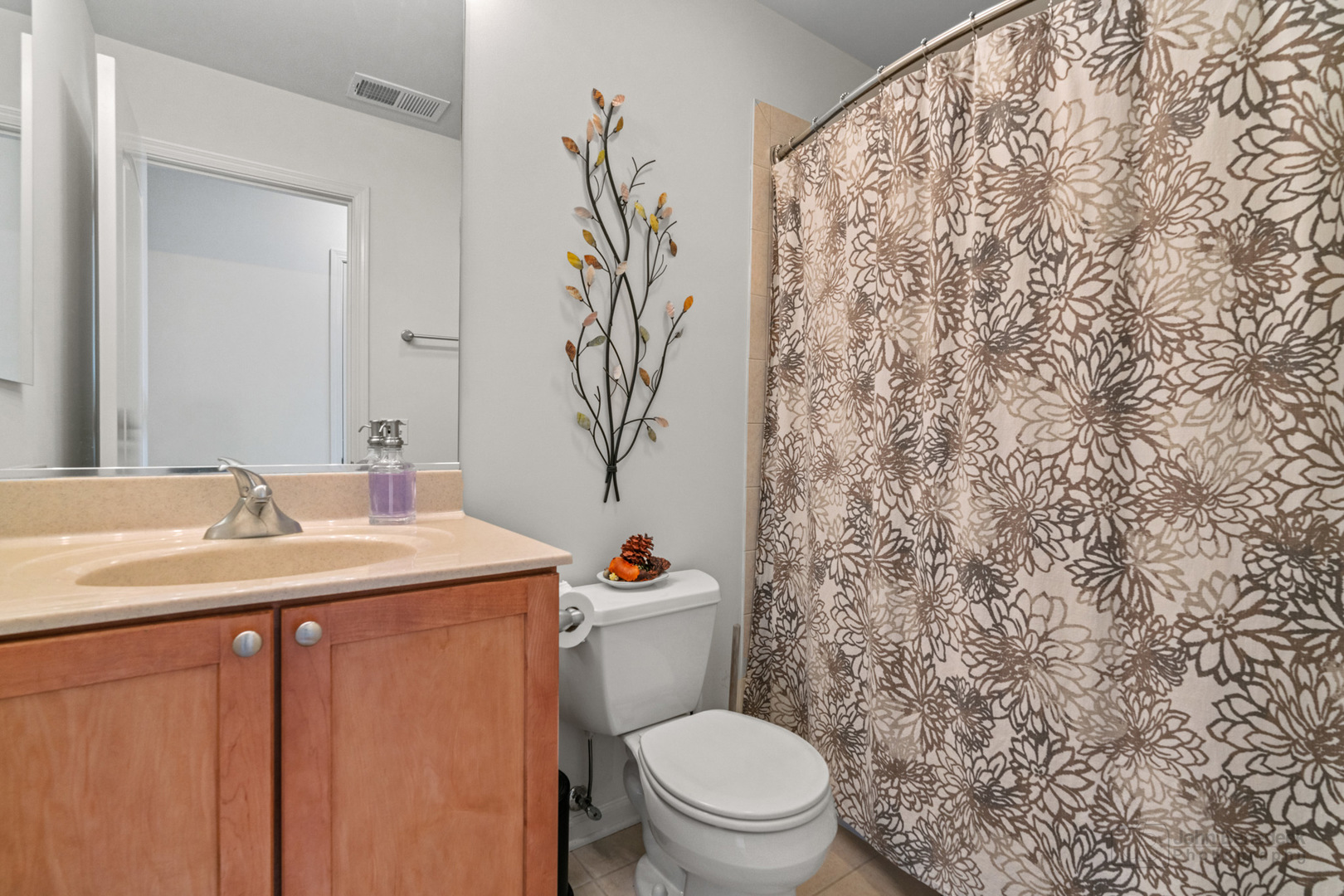 220 River Front Drive Mount Prospect, IL 60056 - Photo 28 of 33 a bathroom with a toilet sink and mirror