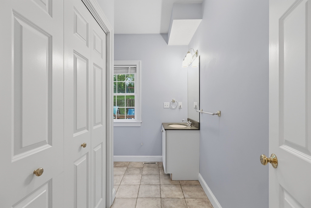 61 Indian Head Road Framingham, MA 01701 - Photo 28 of 42 a view of an entryway with a mirror