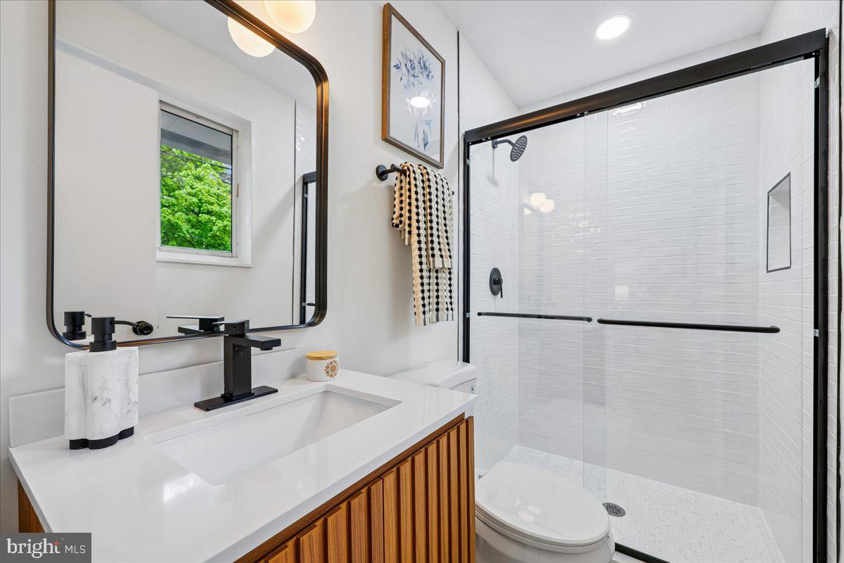 1105 Lamberton Drive Silver Spring, MD 20902 - Photo 31 of 87 Sleek modern bathroom with natural light.