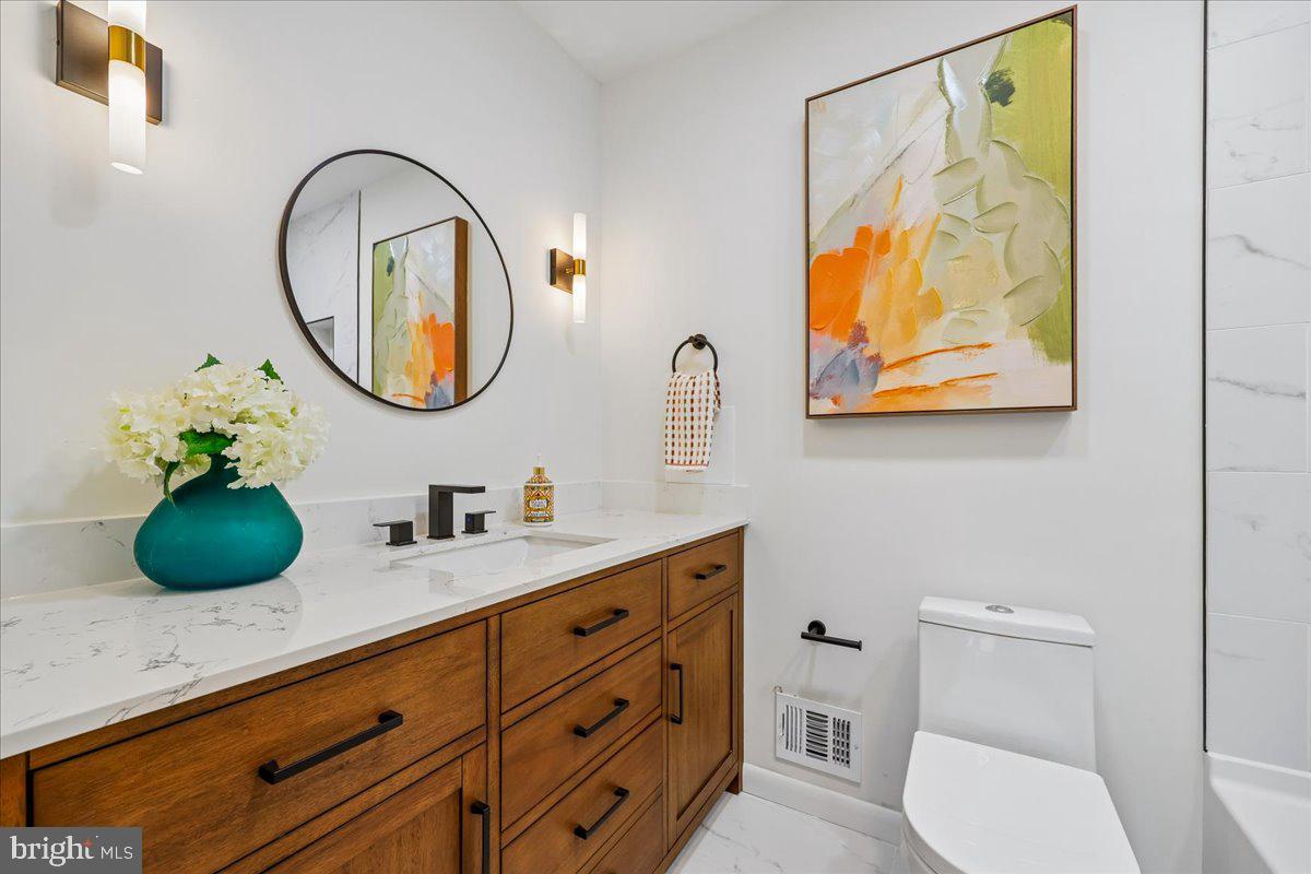 1105 Lamberton Drive Silver Spring, MD 20902 - Photo 36 of 87 Modern elegance in a serene bathroom.