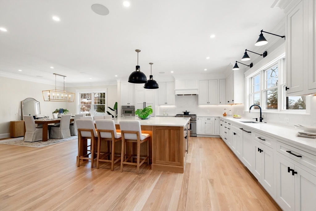2 Abby Road Winchester, MA 01890 - Photo 14 of 42 a large kitchen with a table and chairs in it