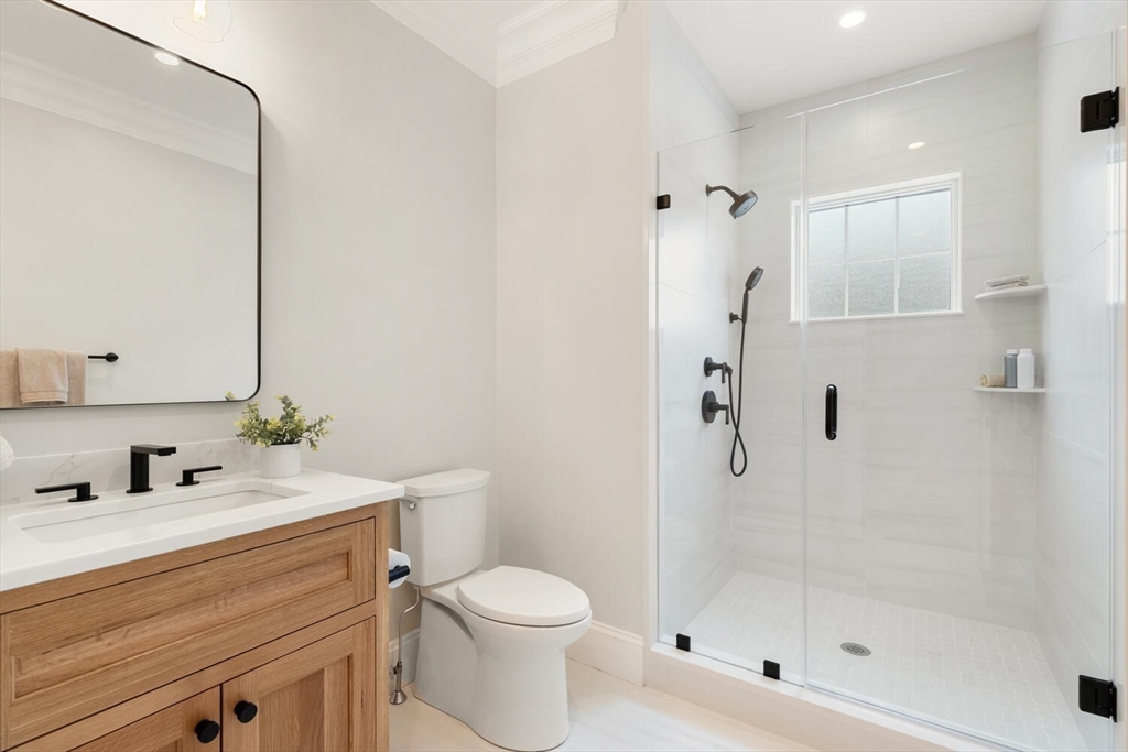 2 Abby Road Winchester, MA 01890 - Photo 20 of 42 a bathroom with a sink toilet and shower