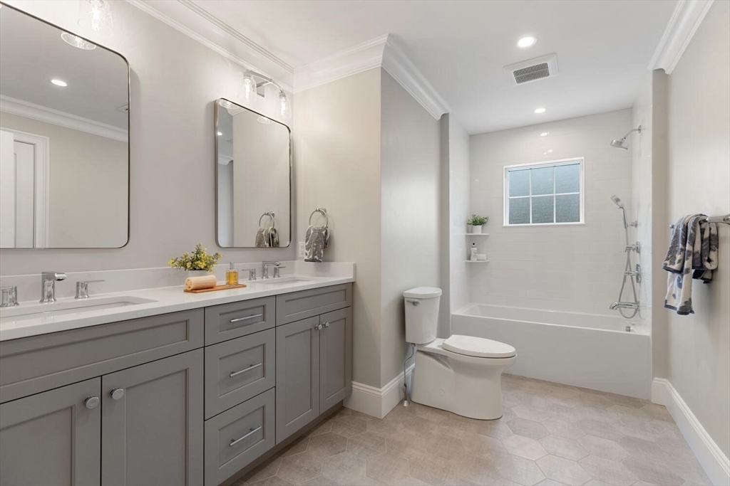 2 Abby Road Winchester, MA 01890 - Photo 27 of 42 a bathroom with a toilet sink and mirror