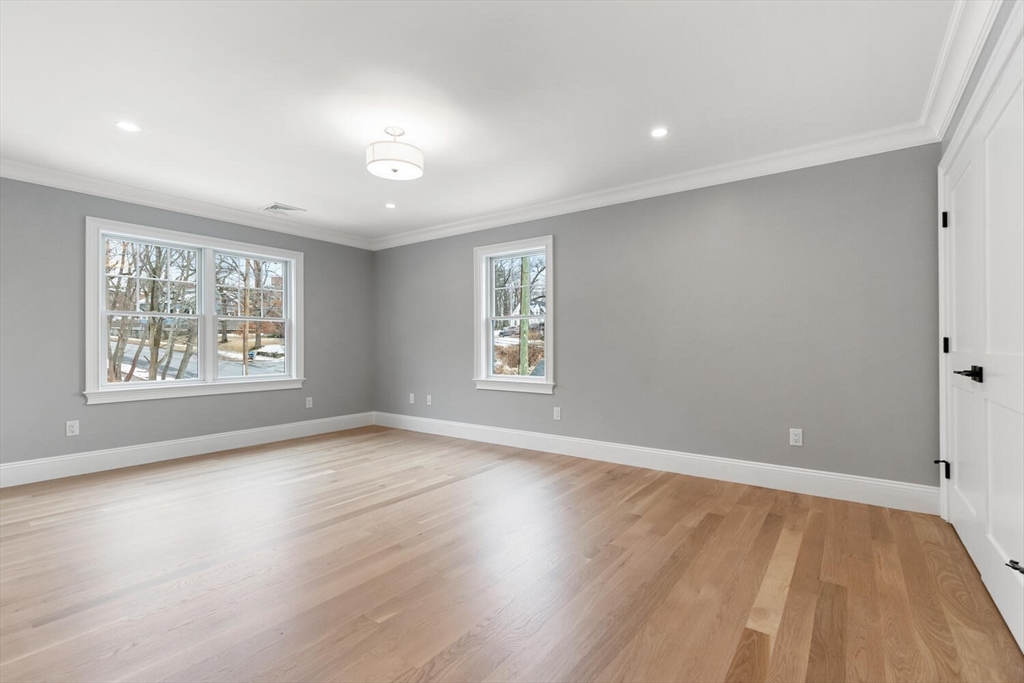2 Abby Road Winchester, MA 01890 - Photo 28 of 42 an empty room with wooden floor and windows