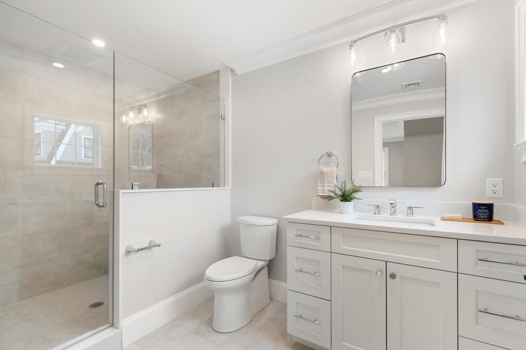 2 Abby Road Winchester, MA 01890 - Photo 30 of 42 a bathroom with a sink a toilet and shower