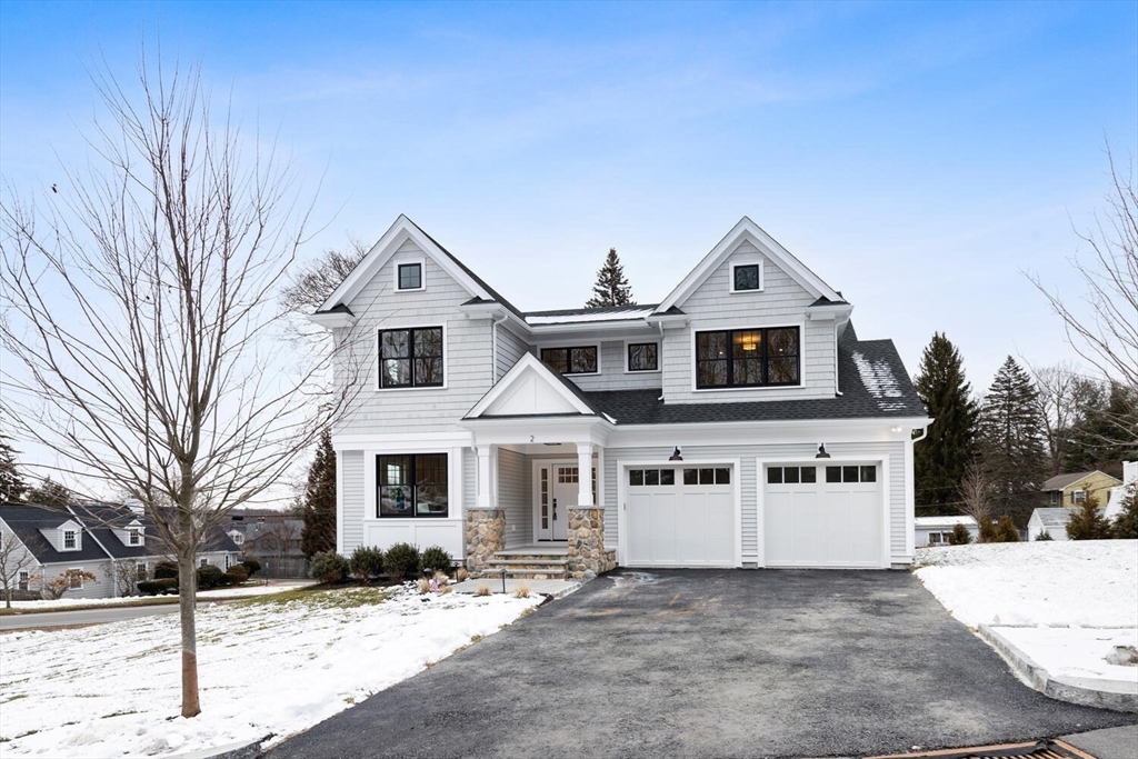 2 Abby Road Winchester, MA 01890 - Photo 3 of 42 a front view of a house with a yard covered with snow in front of house