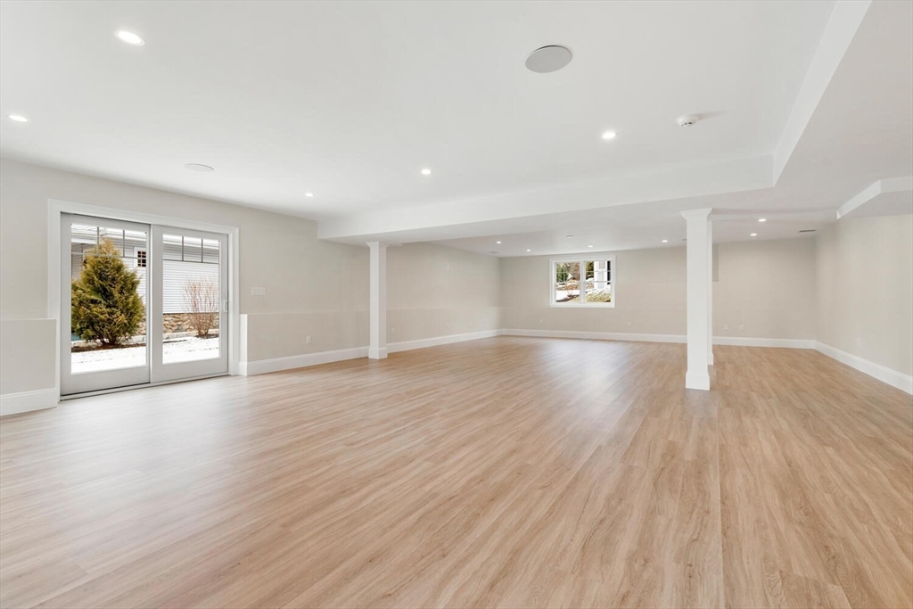 2 Abby Road Winchester, MA 01890 - Photo 31 of 42 a view of empty room with wooden floor and window