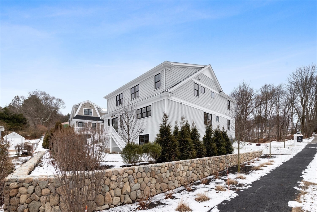 2 Abby Road Winchester, MA 01890 - Photo 37 of 42 a front view of a house with a yard