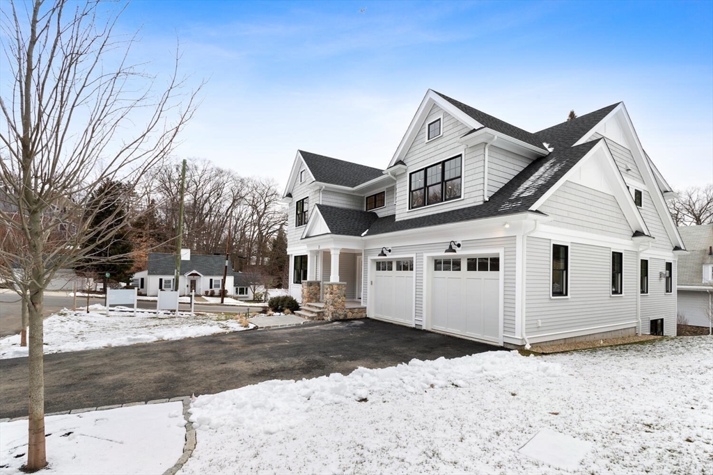2 Abby Road Winchester, MA 01890 - Photo 5 of 42 a view of a white house with a snow on the road