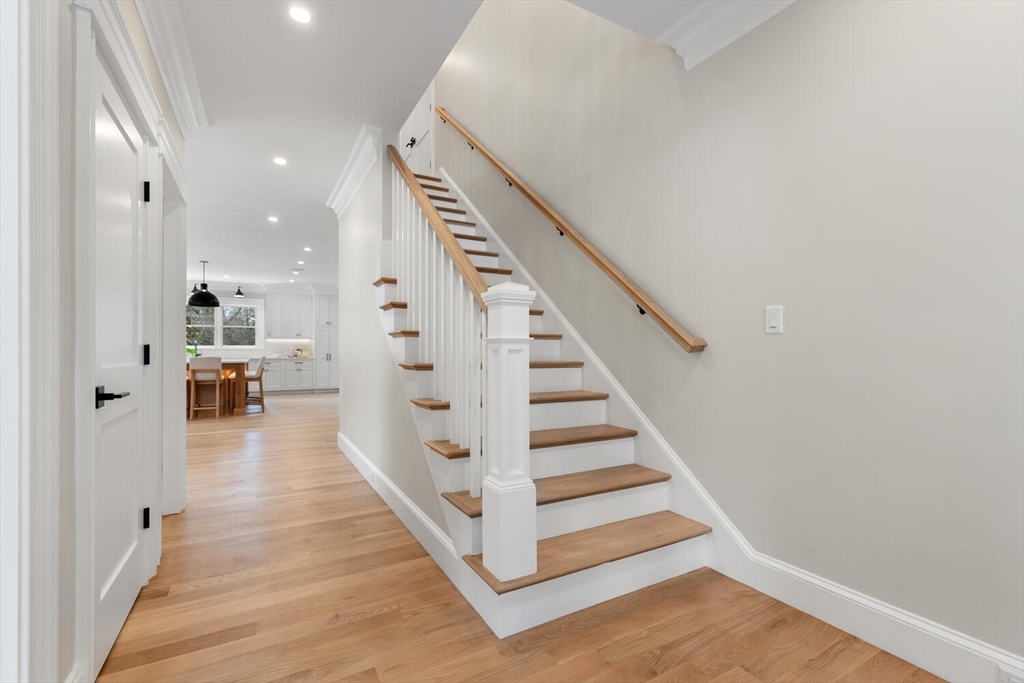 2 Abby Road Winchester, MA 01890 - Photo 7 of 42 a view of a hallway with wooden floor and staircase