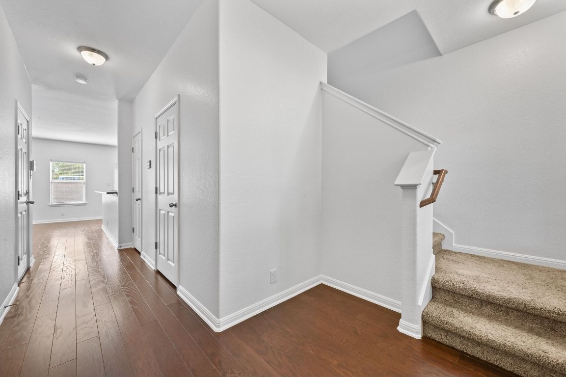 11248 Lost Maples Trail, Unit 11248 Austin, TX 78748 - Photo 3 of 22 a view of a hallway with wooden floor