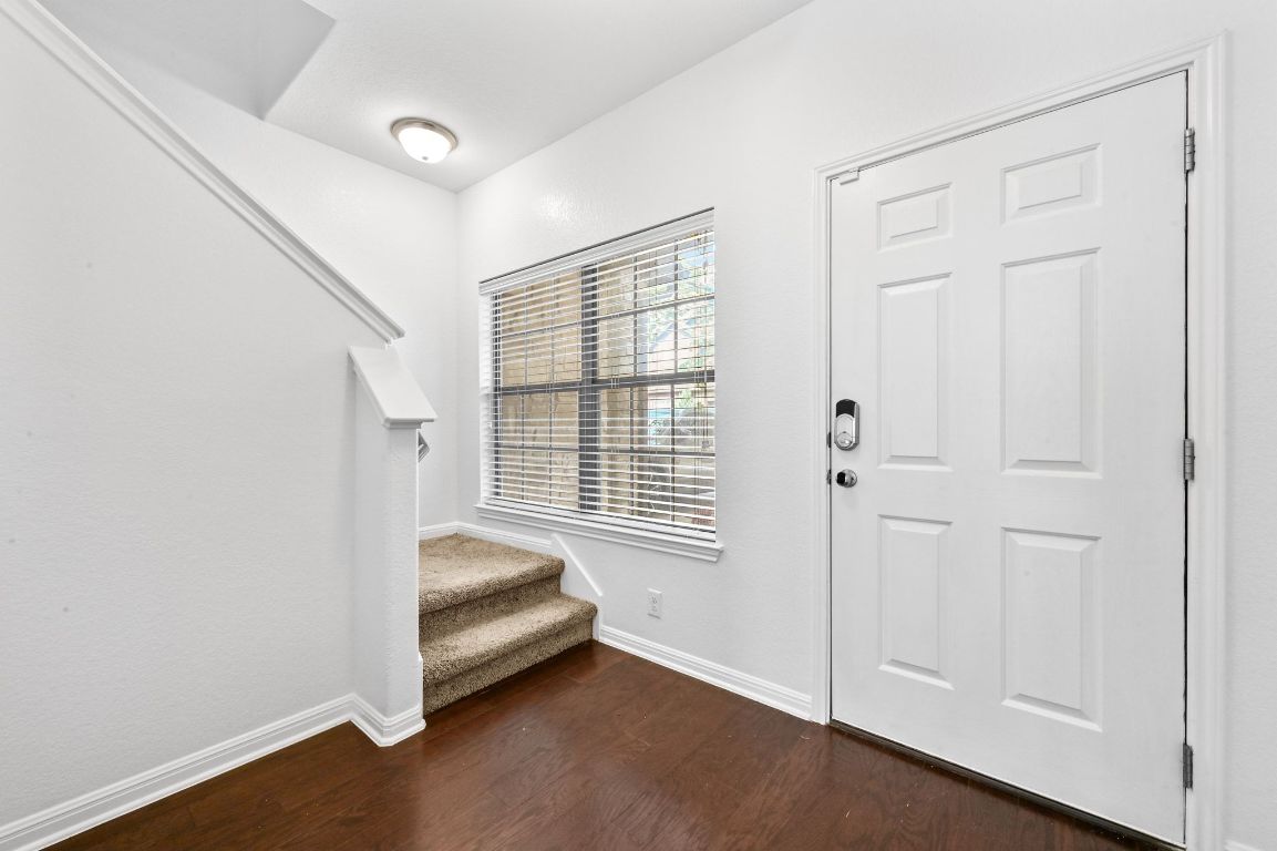 11248 Lost Maples Trail, Unit 11248 Austin, TX 78748 - Photo 4 of 22 a room with window and a ceiling fan