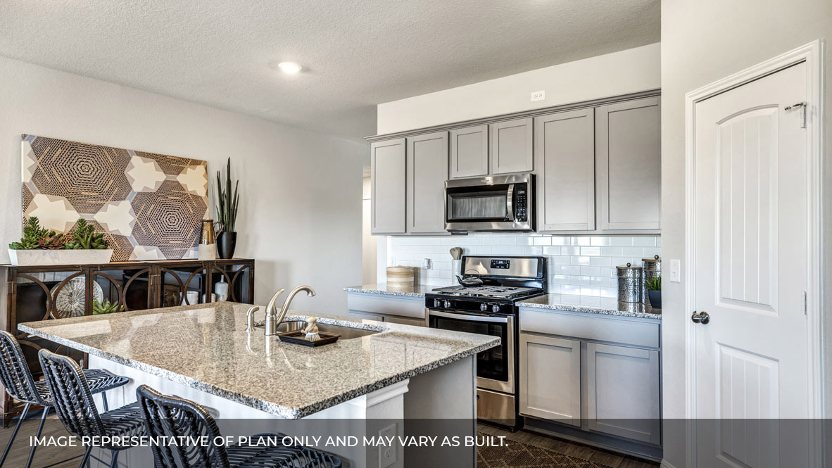 236 Gilmer Lane Buda, TX 78610 - Photo 11 of 30 a kitchen with stainless steel appliances granite countertop a stove a sink a microwave a dining table and chairs