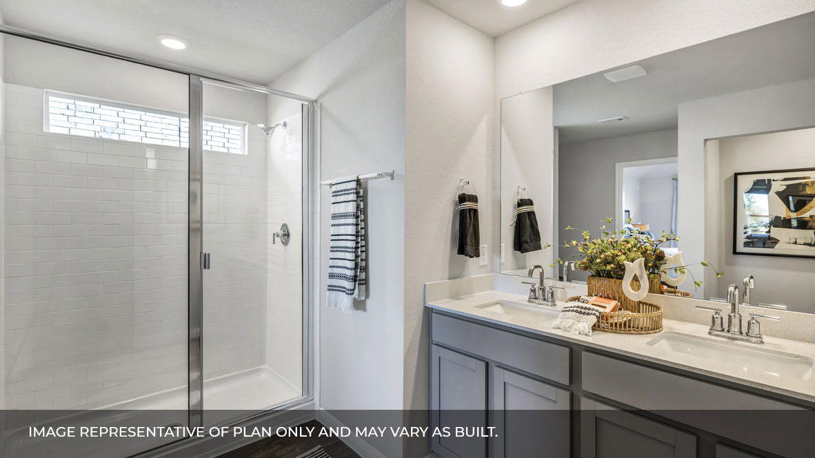 236 Gilmer Lane Buda, TX 78610 - Photo 19 of 30 a bathroom with a shower sink and mirror