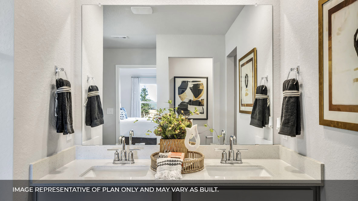 236 Gilmer Lane Buda, TX 78610 - Photo 20 of 30 a bathroom with a sink and a mirror
