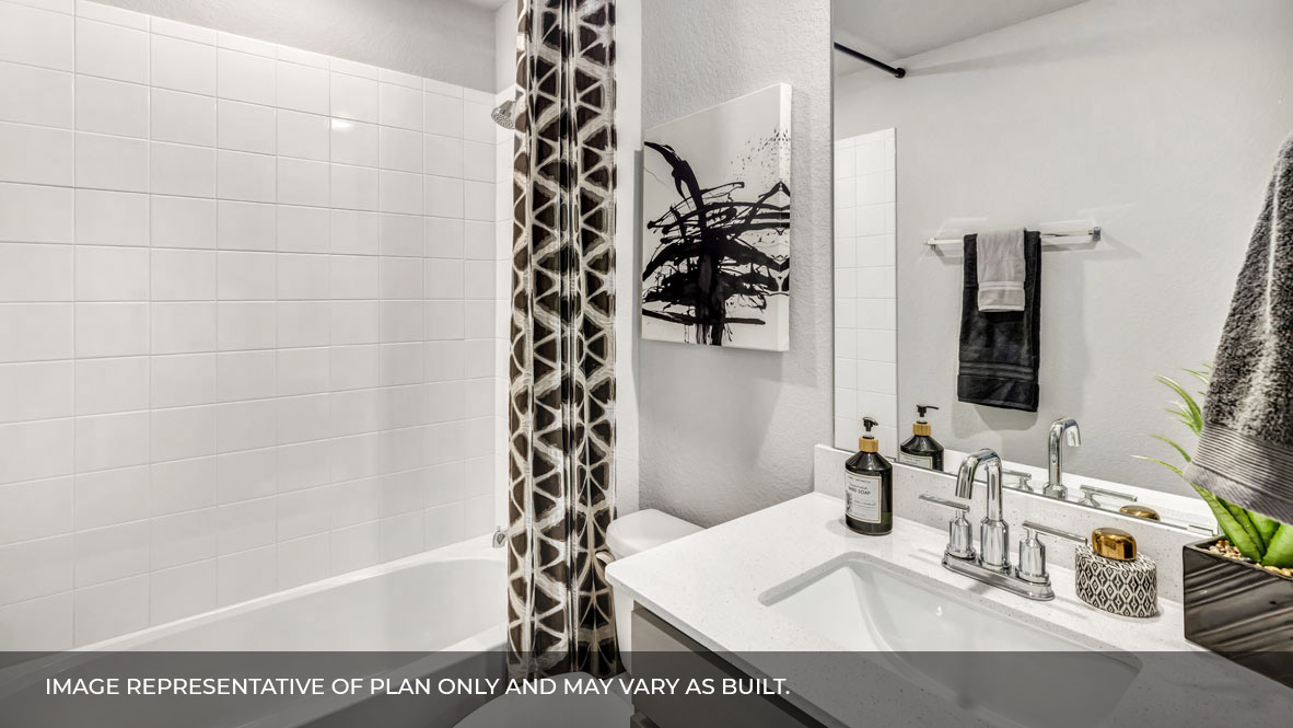 236 Gilmer Lane Buda, TX 78610 - Photo 3 of 30 a bathroom with a bathtub and shower