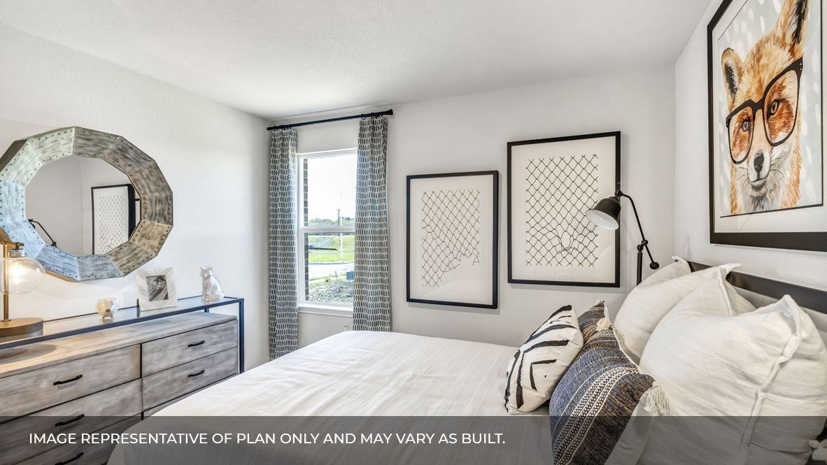 236 Gilmer Lane Buda, TX 78610 - Photo 5 of 30 a bedroom with a large bed and a mirror