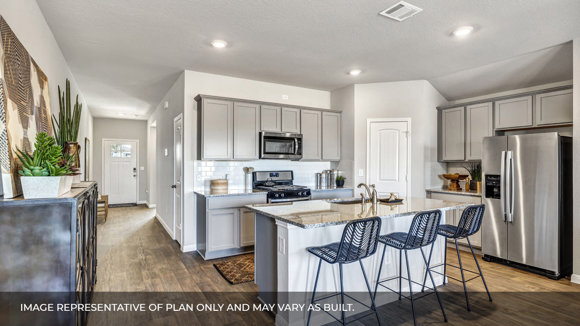 236 Gilmer Lane Buda, TX 78610 - Photo 8 of 30 a kitchen with stainless steel appliances kitchen island granite countertop a stove a refrigerator a sink dishwasher a dining table and chairs with wooden floor