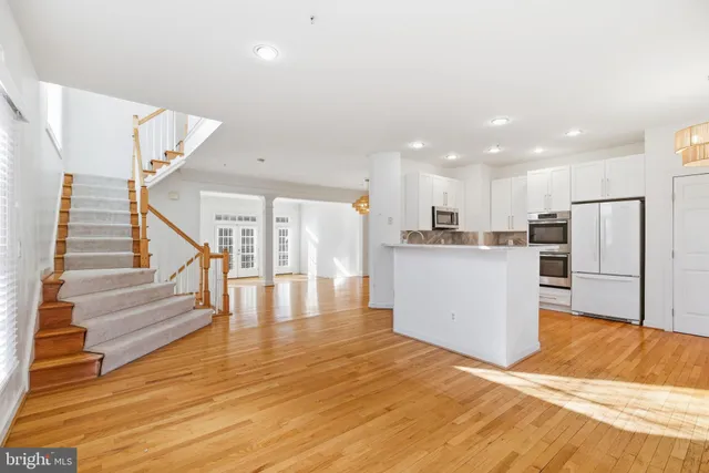 a view of kitchen with cabinets and wooden floor