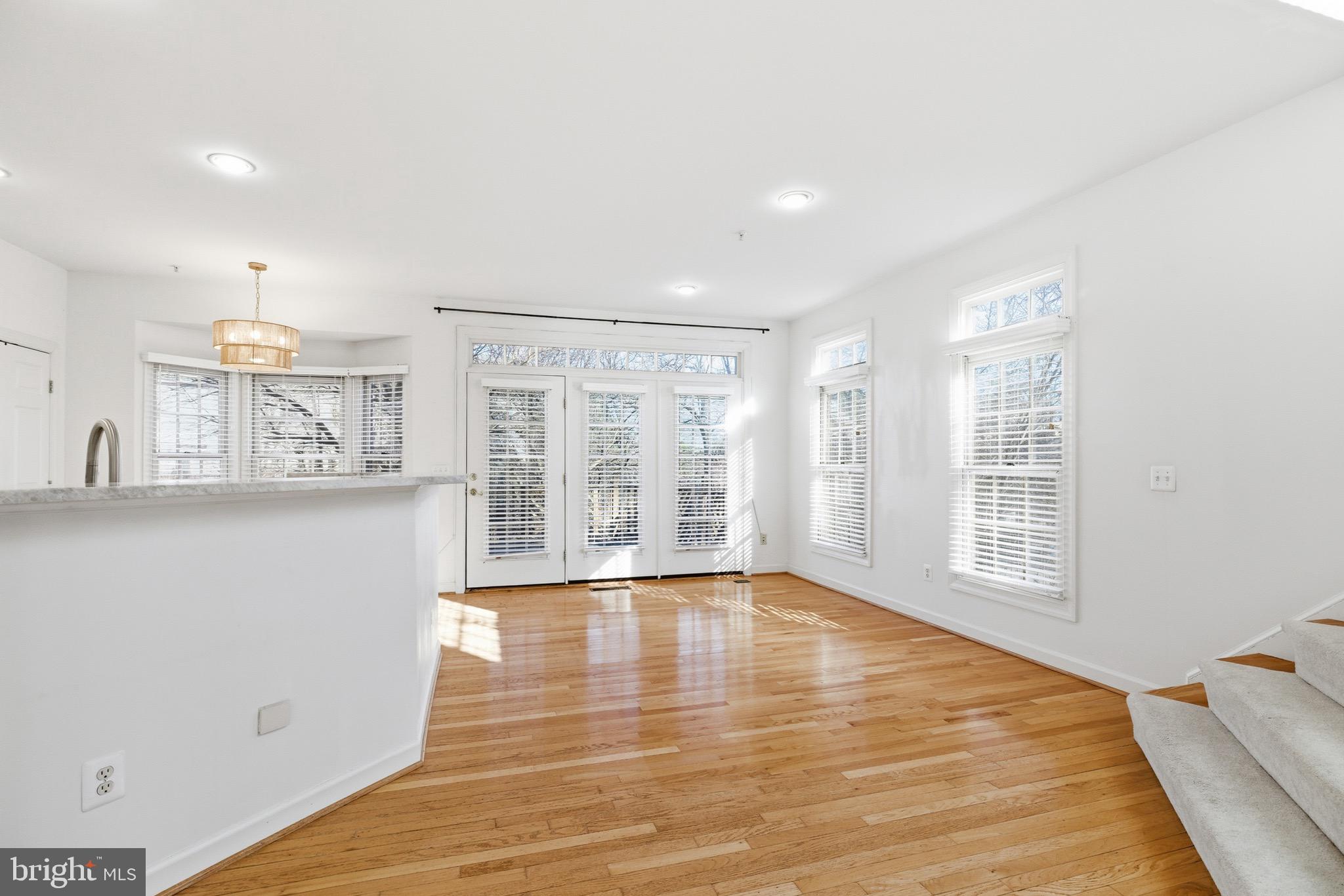 1817 Fallbrook Lane Vienna, VA 22182 - Photo 16 of 50 a view of an empty room with wooden floor and a window