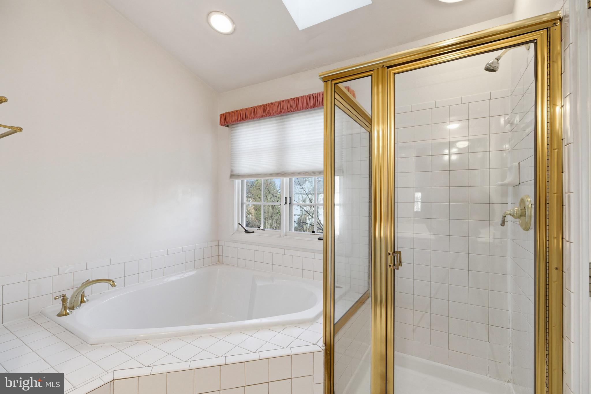 1817 Fallbrook Lane Vienna, VA 22182 - Photo 24 of 50 a bathroom with a bathtub and a shower