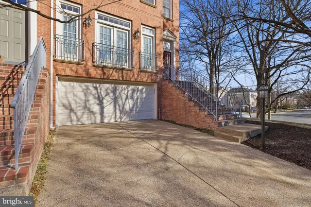 a view of a house with a yard and garage