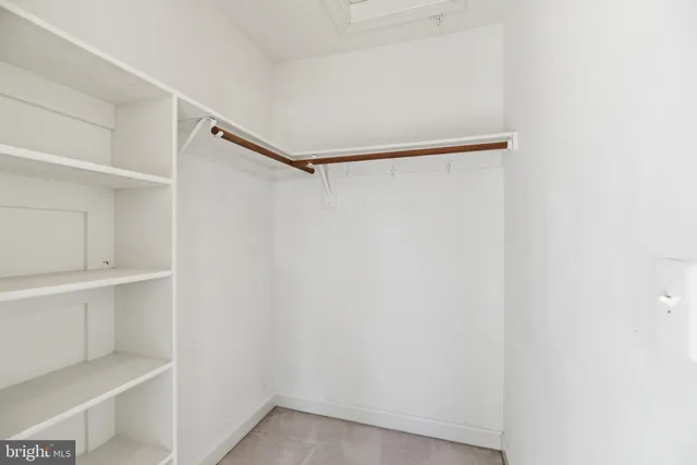 a view of an empty walk in closet