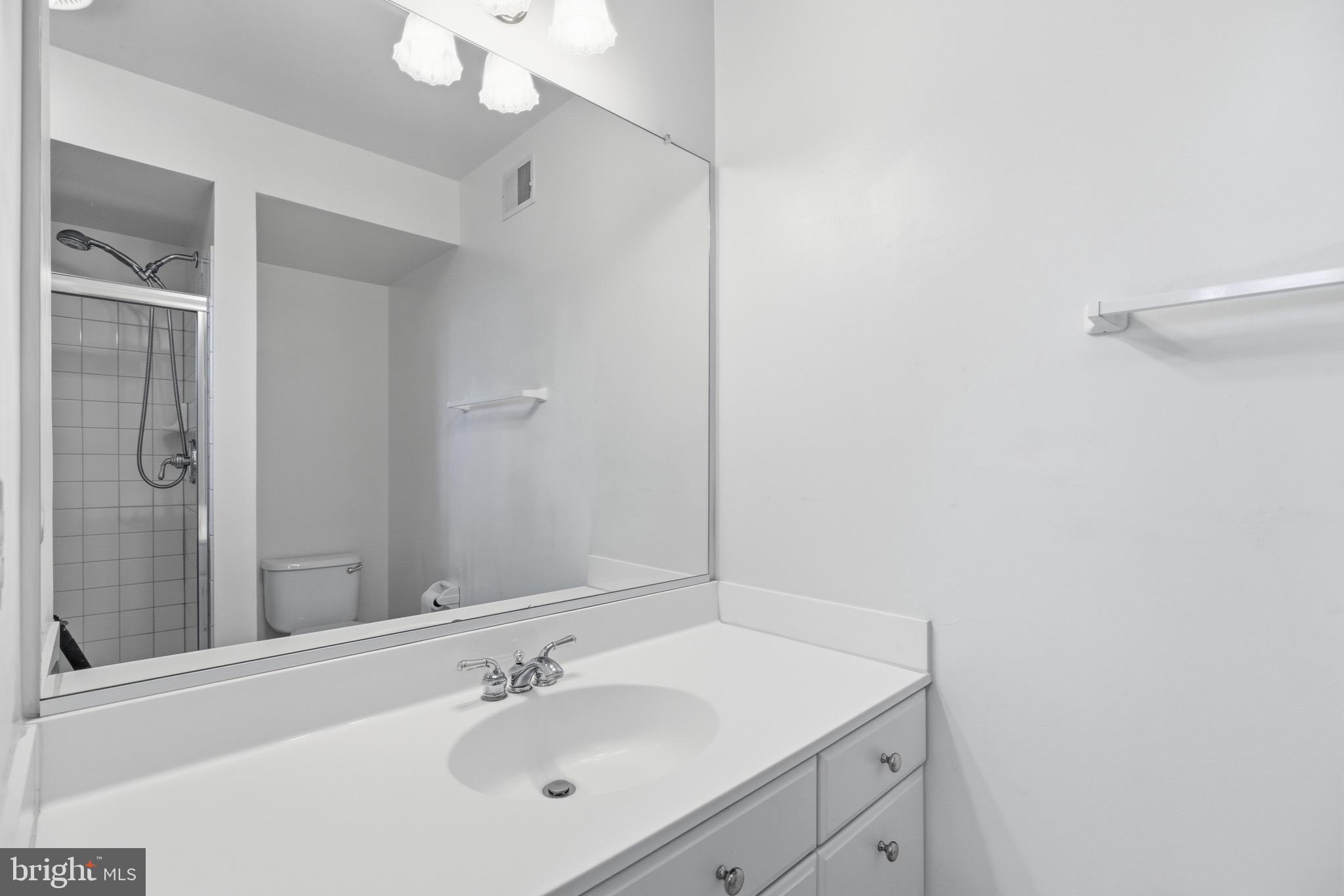 1817 Fallbrook Lane Vienna, VA 22182 - Photo 37 of 50 a bathroom with a sink vanity and a mirror