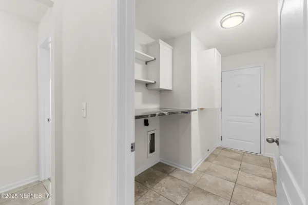 a view of a room with window and pool table