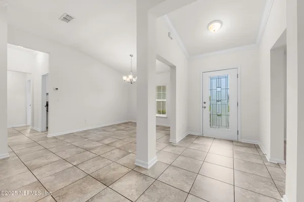 a view of an empty room and window