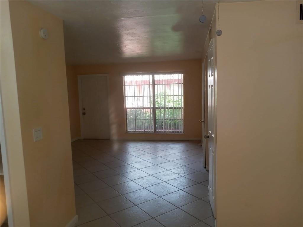 Undisclosed Address Sunrise, FL 33313 - Photo 11 of 15 a view of a hallway with a window