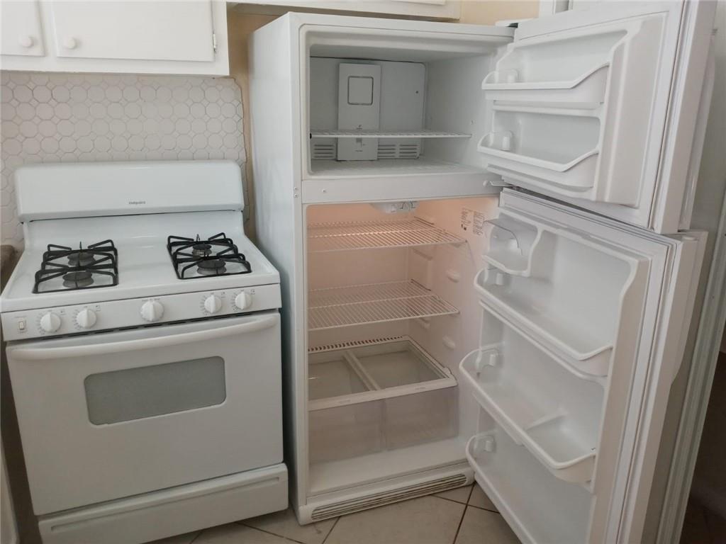 Undisclosed Address Sunrise, FL 33313 - Photo 10 of 15 a utility room with washer and dryer