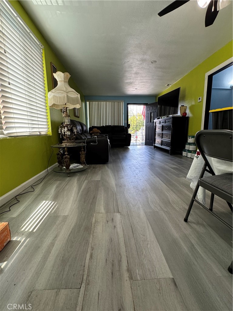 854 North 9th Street Colton, CA 92324 - Photo 14 of 36 a living room with furniture and a wooden floor