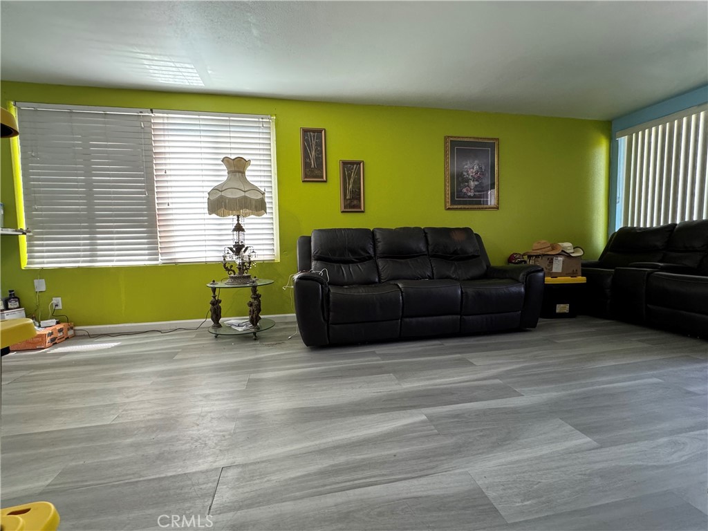 854 North 9th Street Colton, CA 92324 - Photo 15 of 36 a living room with furniture and a window