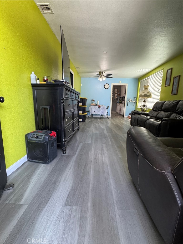 854 North 9th Street Colton, CA 92324 - Photo 17 of 36 a living room with furniture and a flat screen tv