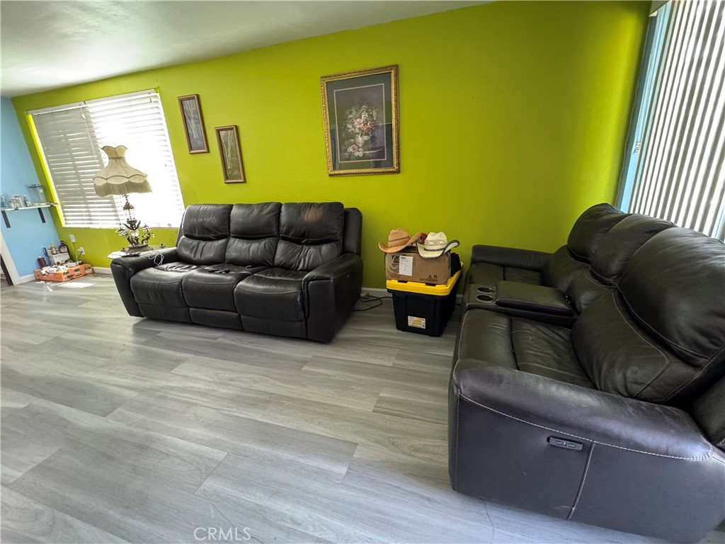 854 North 9th Street Colton, CA 92324 - Photo 18 of 36 a living room with furniture and a window