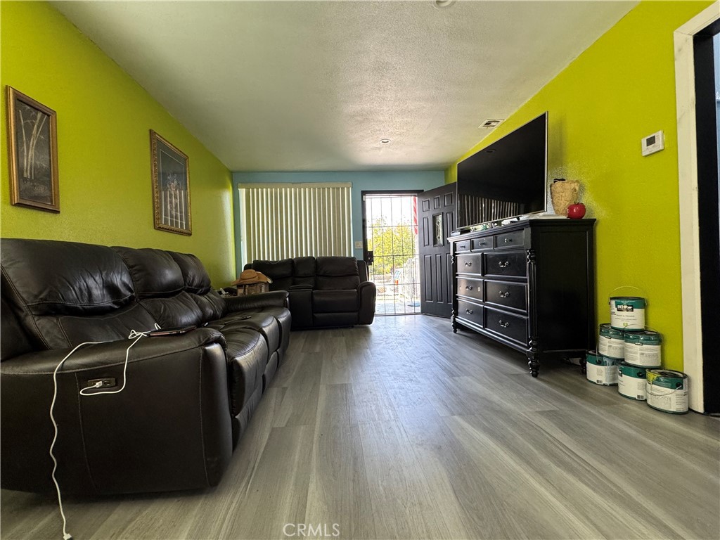 854 North 9th Street Colton, CA 92324 - Photo 19 of 36 a living room with furniture and a flat screen tv