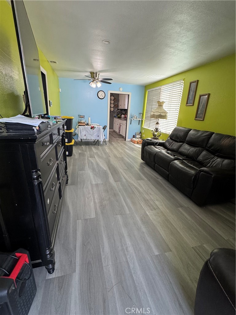 854 North 9th Street Colton, CA 92324 - Photo 20 of 36 a living room with furniture and a flat screen tv