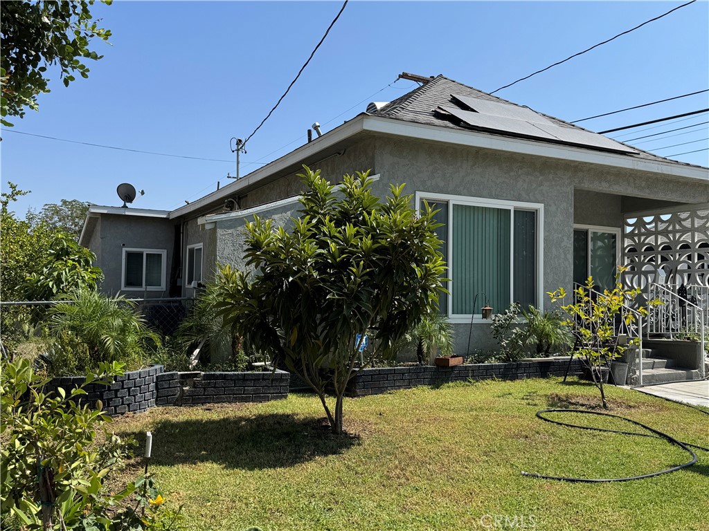 854 North 9th Street Colton, CA 92324 - Photo 26 of 36 a house with a swimming pool in front of it