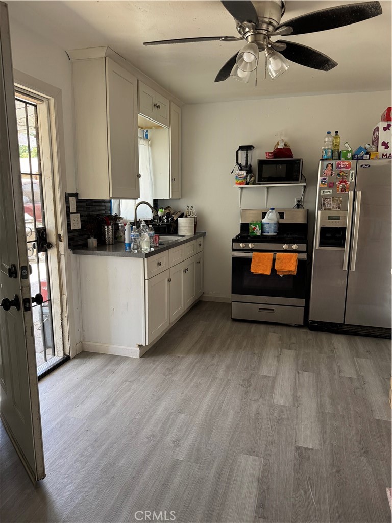 854 North 9th Street Colton, CA 92324 - Photo 32 of 36 a room with furniture and a flat screen tv