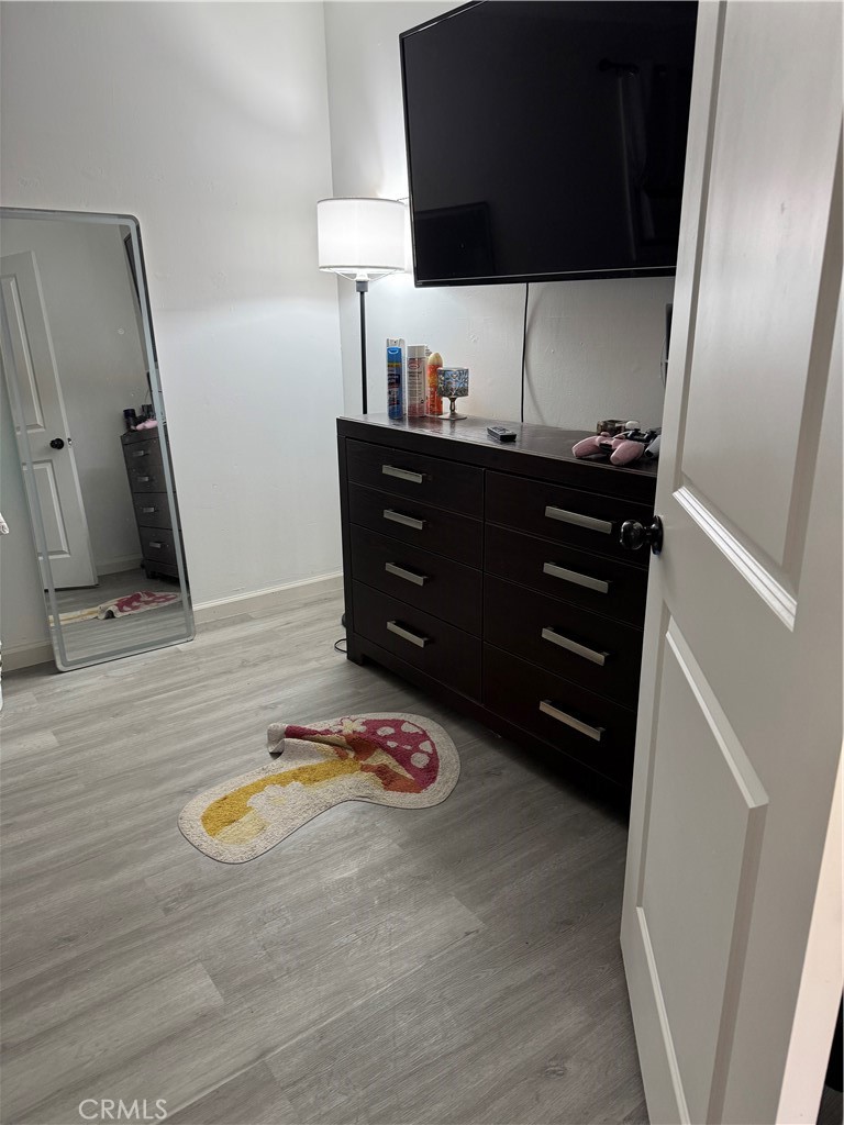 854 North 9th Street Colton, CA 92324 - Photo 34 of 36 a view of a closet with wooden floor