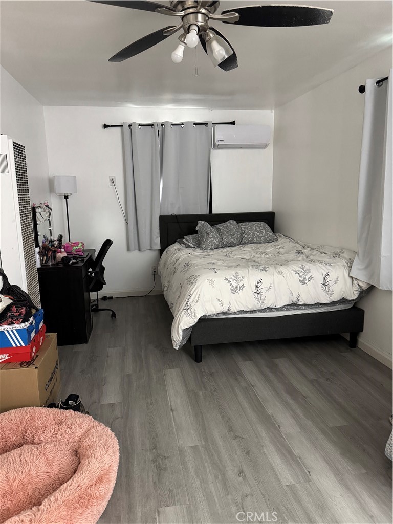 854 North 9th Street Colton, CA 92324 - Photo 35 of 36 a bedroom with a bed and window