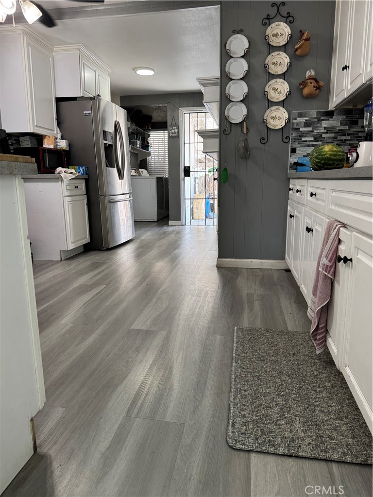 854 North 9th Street Colton, CA 92324 - Photo 6 of 36 a kitchen with stainless steel appliances granite countertop a refrigerator sink and stove
